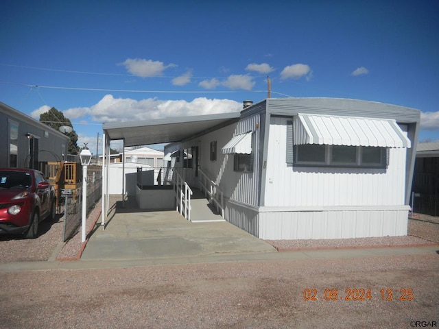 view of front of home with a carport