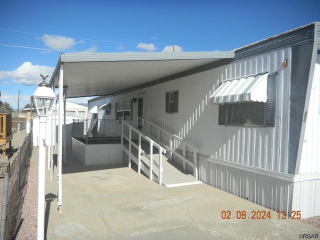 exterior space with a carport