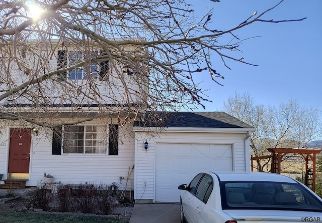 view of front of property featuring a garage