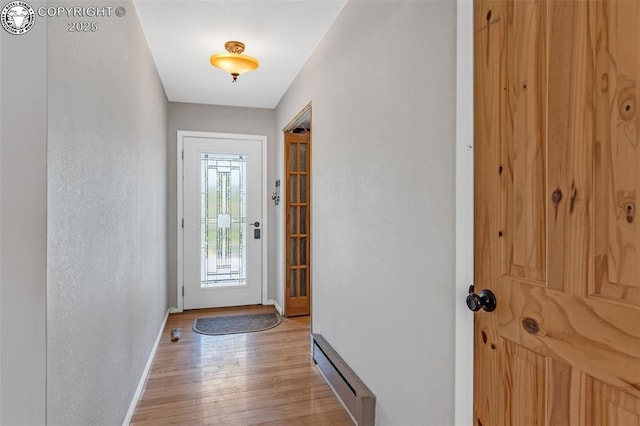 3082 High St, Canon City, CO 81212 - doorway with baseboards, light wood-type flooring, and a baseboard heating unit