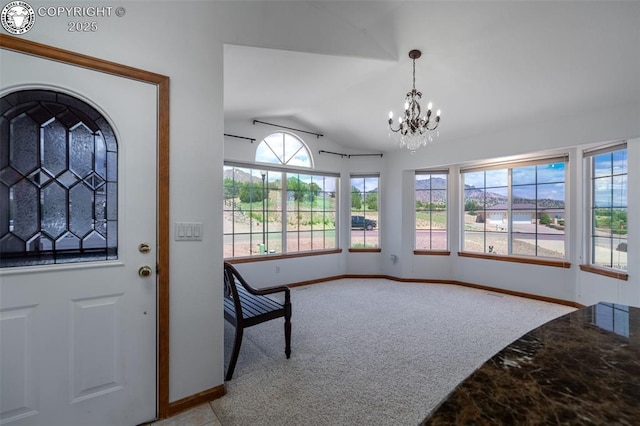 46 Wild Rose Dr, Canon City, CO 81212 - entrance foyer featuring vaulted ceiling, carpet, and a chandelier