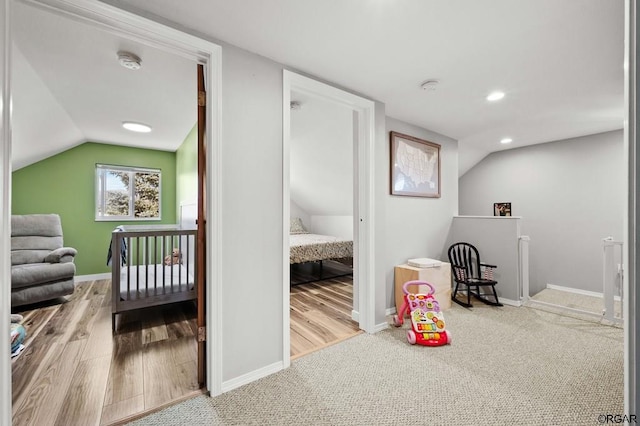 game room featuring lofted ceiling and light colored carpet