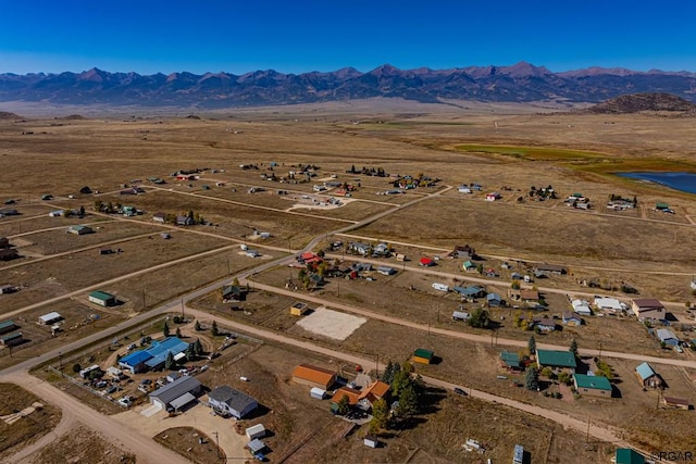 drone / aerial view featuring a mountain view