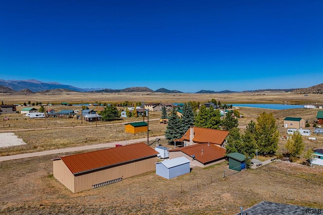 bird's eye view featuring a water and mountain view