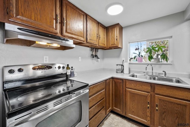 kitchen featuring sink and electric stove