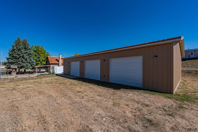 garage with a lawn