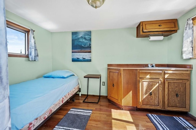 bedroom with hardwood / wood-style flooring