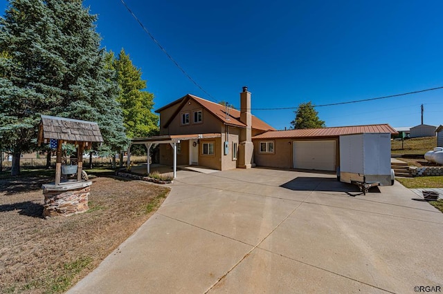 view of front of home featuring a garage and a carport