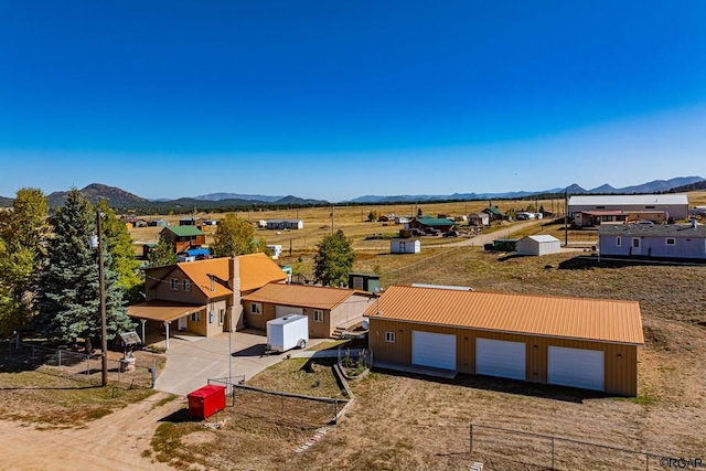 birds eye view of property featuring a mountain view