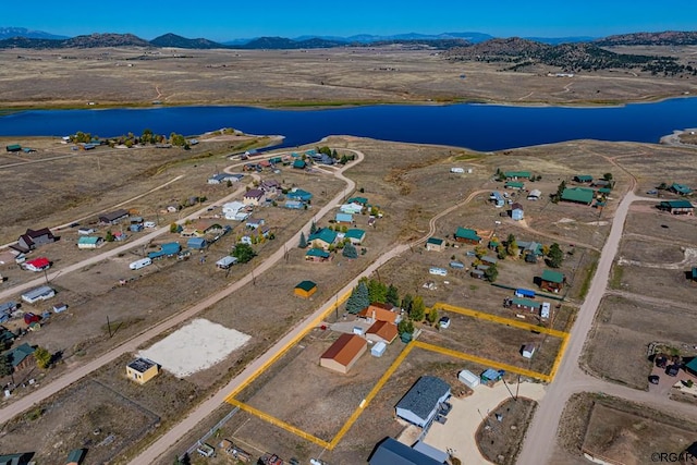 aerial view with a water and mountain view