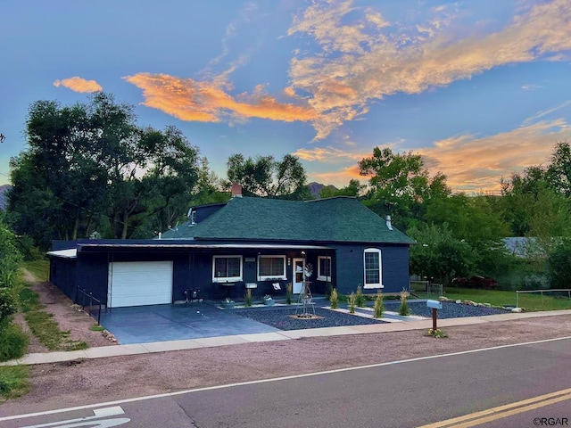 ranch-style house featuring a garage