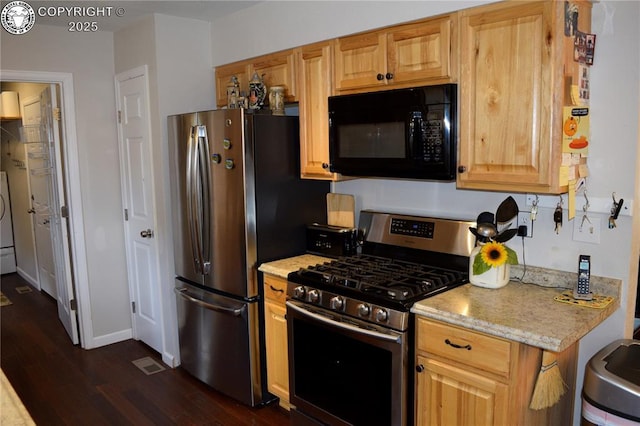 113 Rio Grande Dr, Canon City, CO 81212 - kitchen with appliances with stainless steel finishes, dark wood-style flooring, light stone counters, and washer / dryer