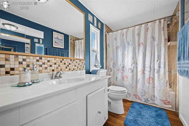 full bathroom featuring tasteful backsplash, hardwood / wood-style flooring, toilet, and shower / bathtub combination with curtain