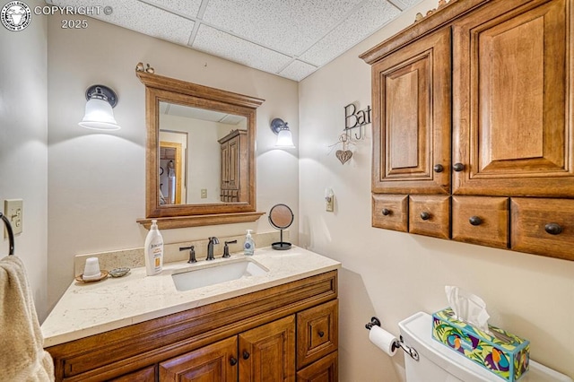 136 Beneaton Ln, Westcliffe, CO 81252 - bathroom featuring a paneled ceiling, vanity, and toilet