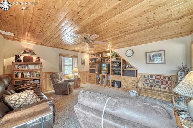 136 Beneaton Ln, Westcliffe, CO 81252 - living room with wainscoting, carpet floors, wood ceiling, ceiling fan, and wooden walls