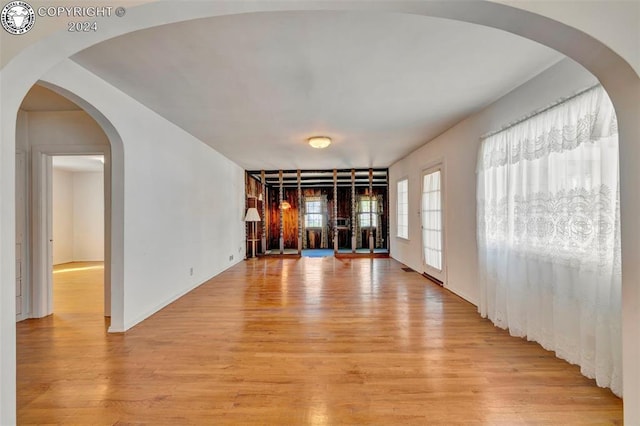 empty room with light hardwood / wood-style flooring