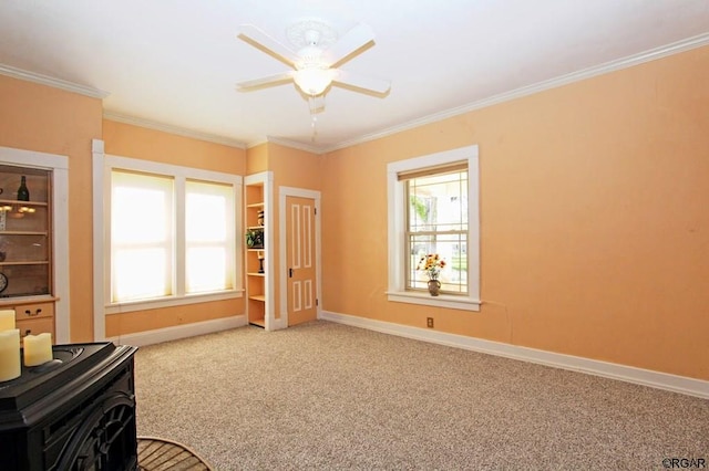 interior space featuring ornamental molding and ceiling fan