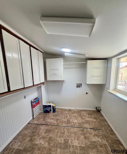 laundry room featuring cabinets, hookup for an electric dryer, and hookup for a washing machine