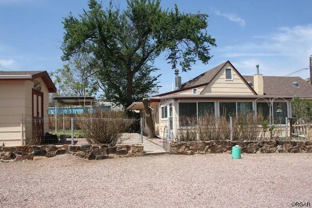 view of front facade featuring a sunroom