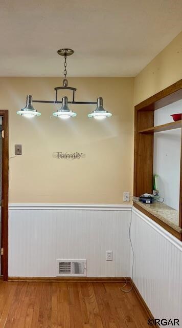 unfurnished dining area with light hardwood / wood-style floors