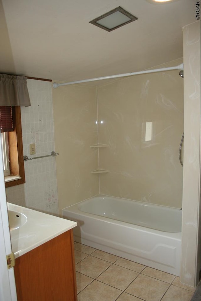 bathroom with vanity, tile patterned flooring, and shower / bathtub combination