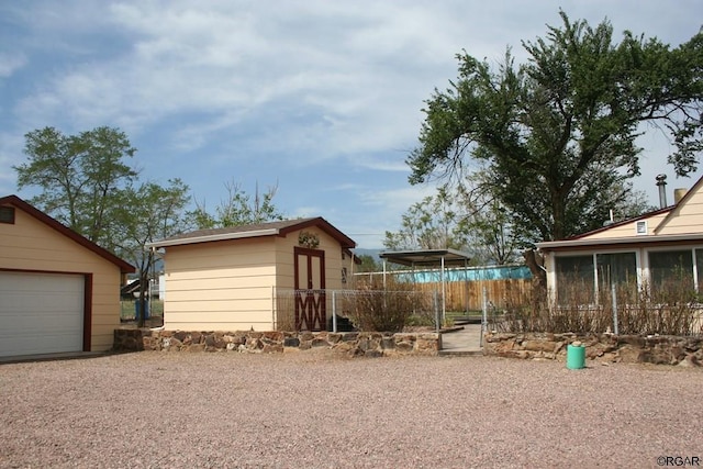 view of yard with a garage and a shed