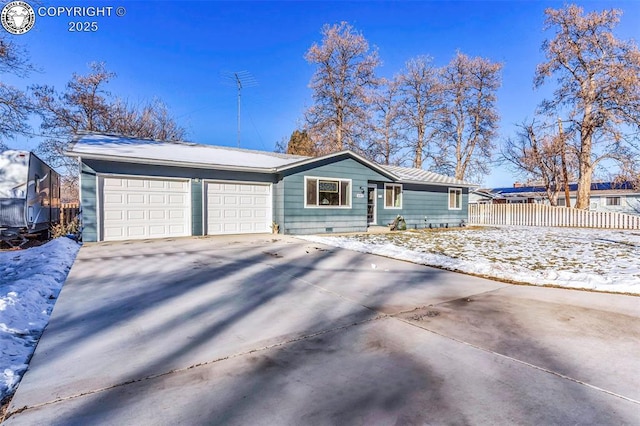 ranch-style home with a garage