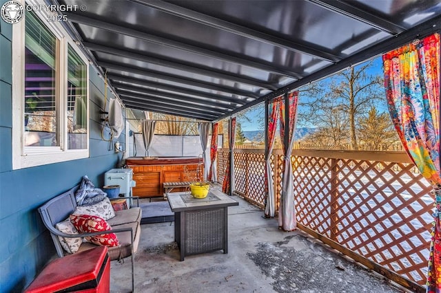 view of patio featuring a hot tub