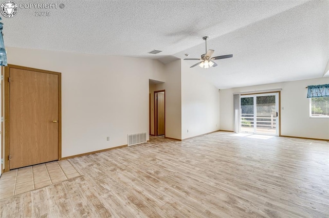 168 Willmoor Ct, Canon City, CO 81212 - empty room featuring light wood-style flooring, a textured ceiling, lofted ceiling, and a ceiling fan