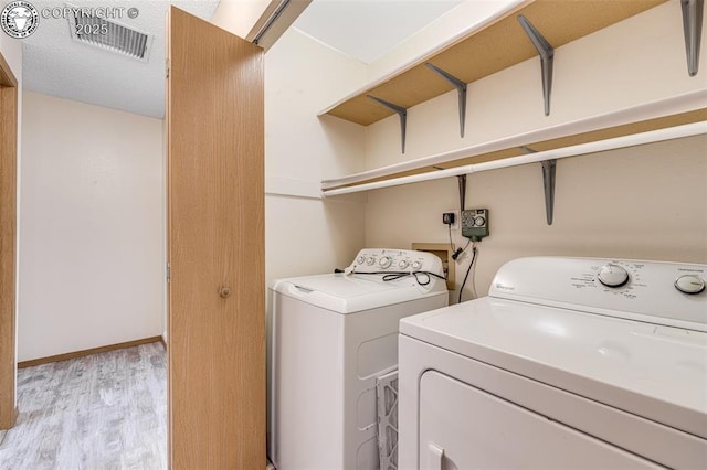 168 Willmoor Ct, Canon City, CO 81212 - washroom with washer and dryer and light wood-type flooring
