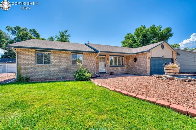 168 Willmoor Ct, Canon City, CO 81212 - ranch-style house featuring an attached garage, brick siding, and a front yard