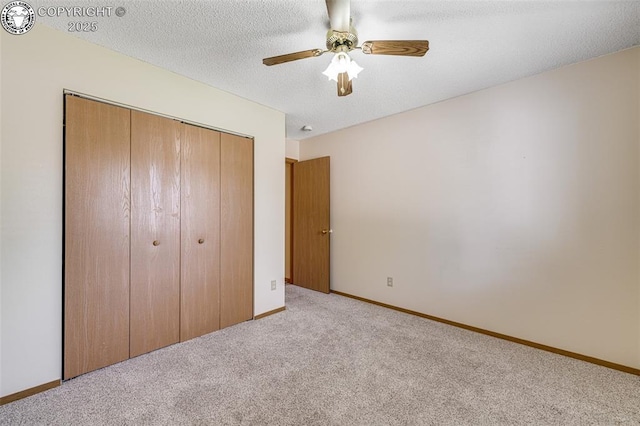 168 Willmoor Ct, Canon City, CO 81212 - unfurnished bedroom featuring carpet, a closet, a ceiling fan, and a textured ceiling