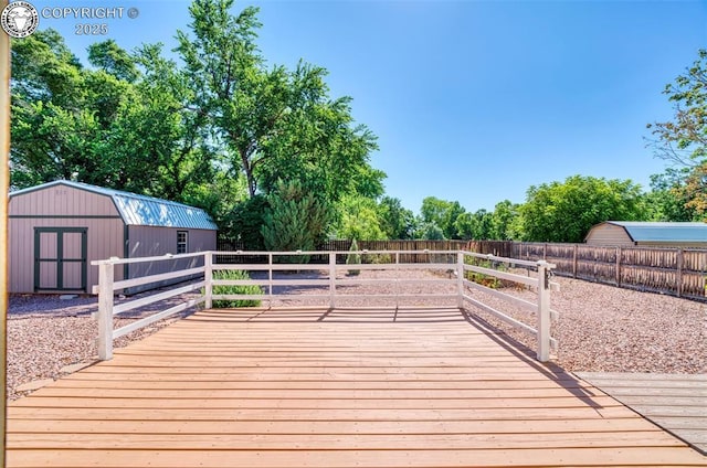 168 Willmoor Ct, Canon City, CO 81212 - wooden deck featuring a storage unit, a fenced backyard, and view of wooded area