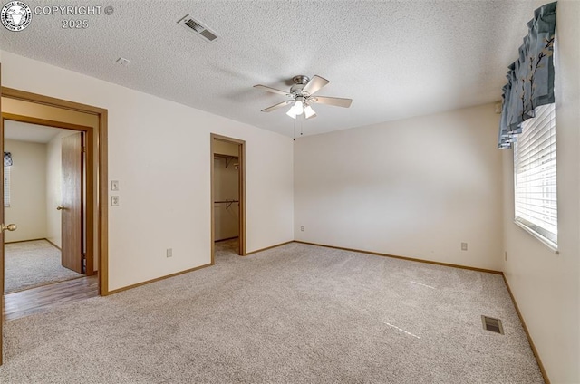 168 Willmoor Ct, Canon City, CO 81212 - unfurnished room featuring light colored carpet, a ceiling fan, and a textured ceiling