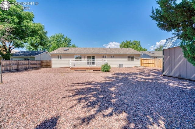 168 Willmoor Ct, Canon City, CO 81212 - rear view of house with a storage shed, a deck, and a fenced backyard