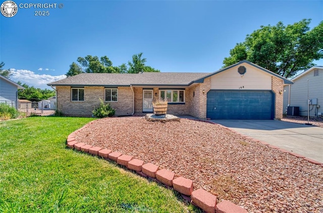 168 Willmoor Ct, Canon City, CO 81212 - single story home with a garage, concrete driveway, and brick siding