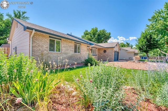 168 Willmoor Ct, Canon City, CO 81212 - view of front of property with brick siding and an attached garage
