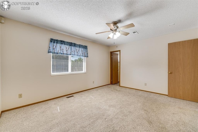 168 Willmoor Ct, Canon City, CO 81212 - empty room with carpet, ceiling fan, and a textured ceiling
