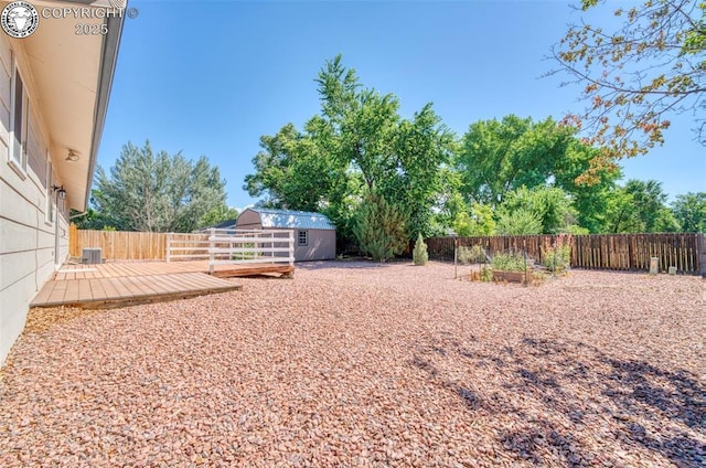 168 Willmoor Ct, Canon City, CO 81212 - fenced backyard featuring a storage unit and a wooden deck