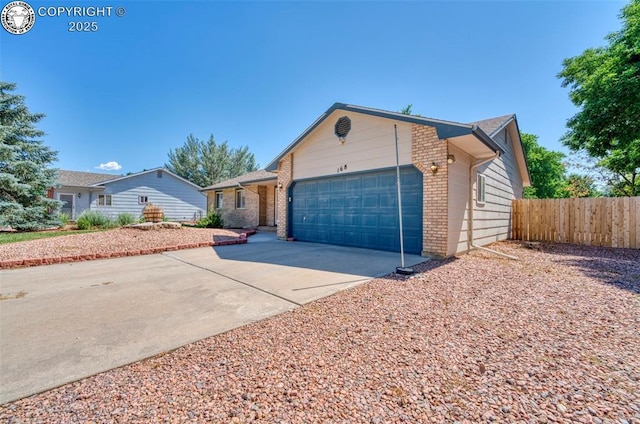 168 Willmoor Ct, Canon City, CO 81212 - single story home with brick siding, an attached garage, and driveway