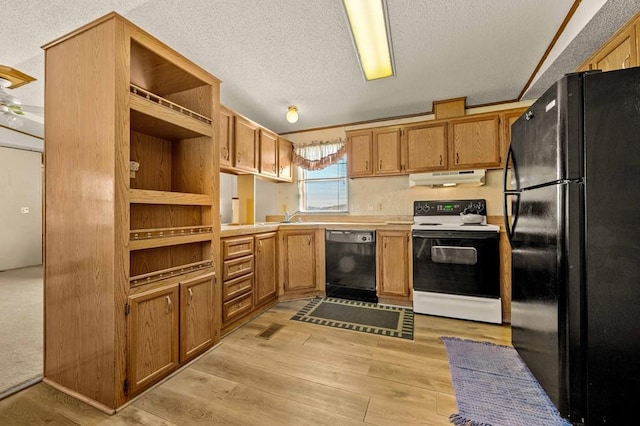 kitchen with sink, light hardwood / wood-style floors, a textured ceiling, and black appliances