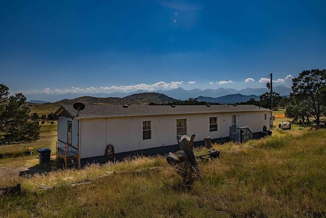 view of home's exterior featuring a mountain view