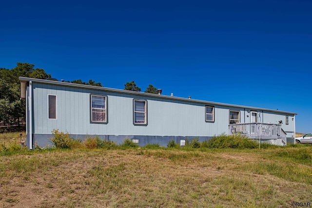 view of property exterior featuring a yard