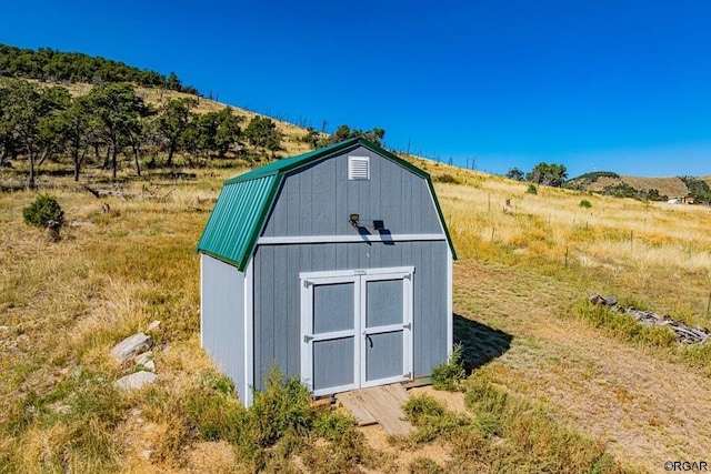 view of outdoor structure featuring a rural view