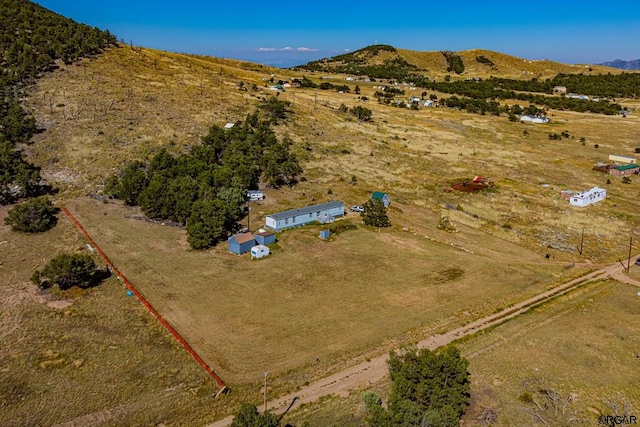 bird's eye view featuring a mountain view and a rural view