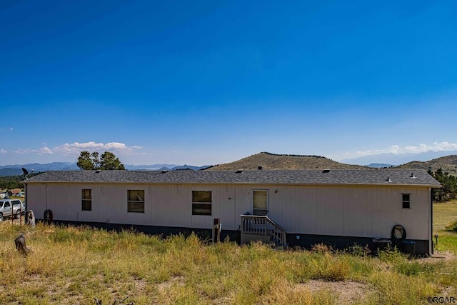 rear view of house with a mountain view