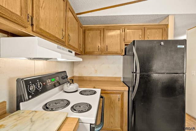 kitchen featuring lofted ceiling, wooden counters, range with electric stovetop, a textured ceiling, and black fridge