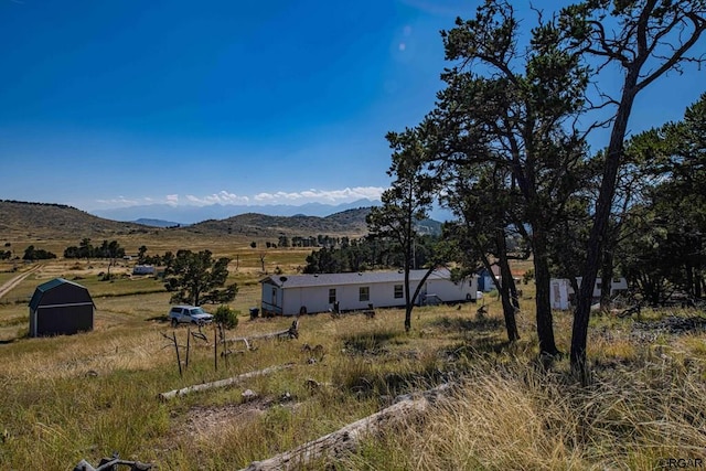 mountain view featuring a rural view