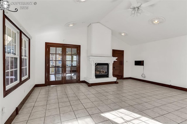 unfurnished living room featuring lofted ceiling, french doors, and light tile patterned flooring