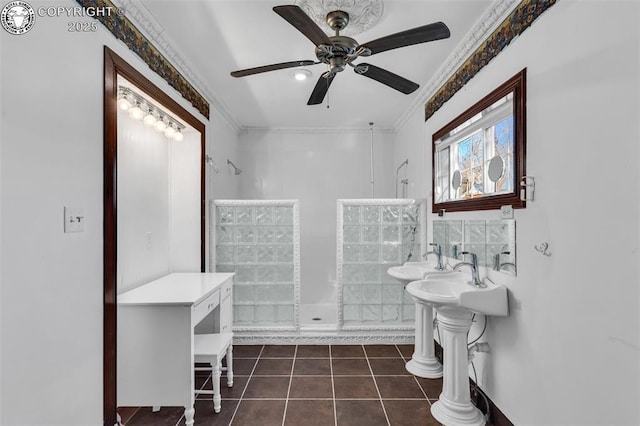 bathroom featuring tile patterned flooring, a shower, decorative columns, and crown molding